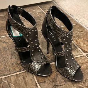 Guess heels. Color pewter.  Leather/man made upper.  Size 6.  Never worn
